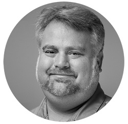 Erik Romanek managed services director portrait