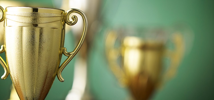 Close up champion golden trophy Boston Business Journal award concept