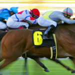 Horserace at the finish line, blurred image to show speed