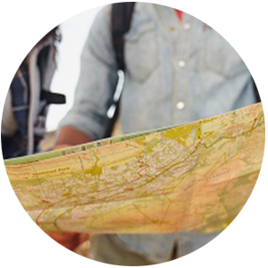 hikers holding a map to get direction
