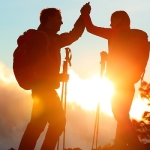 Hikers at the Top Celebrating Success Concept