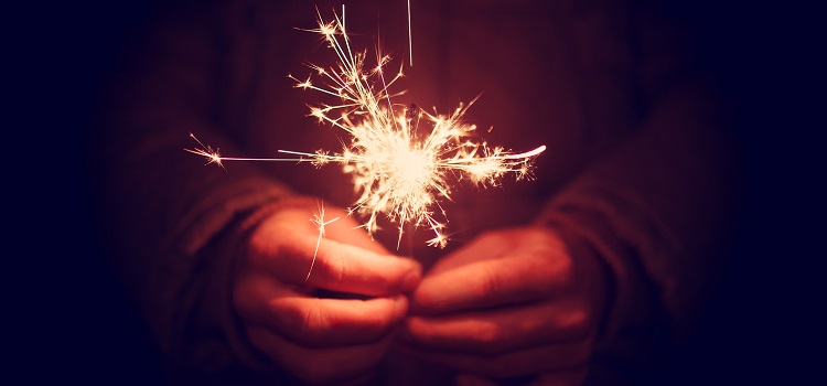 Spark concept man holding sparkler